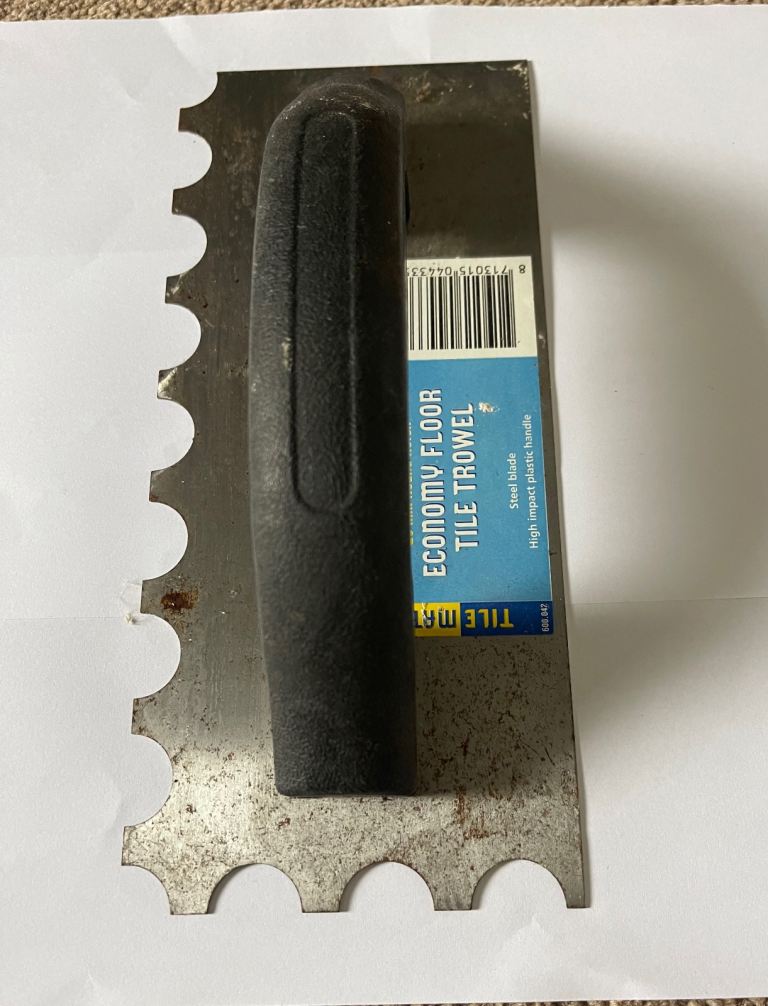 Floor tile trowel