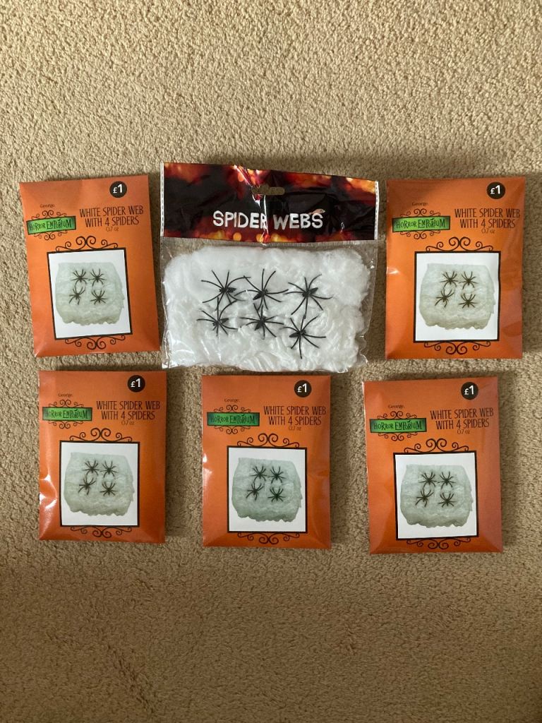 Six spiders webs with spiders