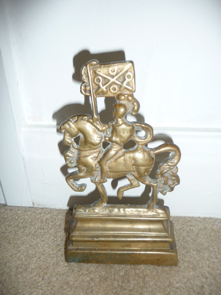 Vintage Brass Door Stopper Mounted Knight with banner, lead filled base.