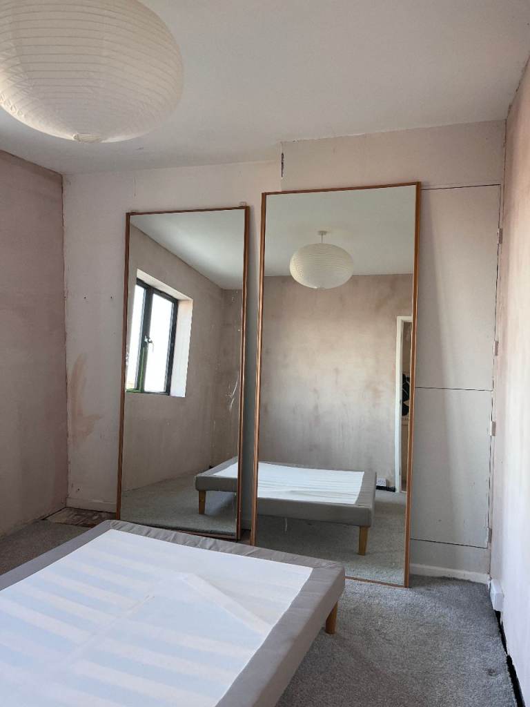 Mirrored sliding doors with rail