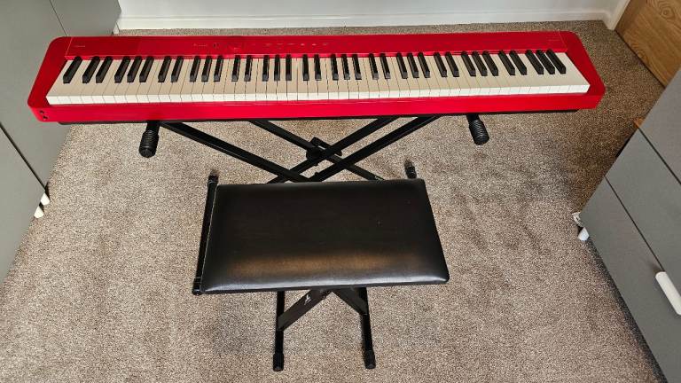 Casio Privia PX-S1100 in red.