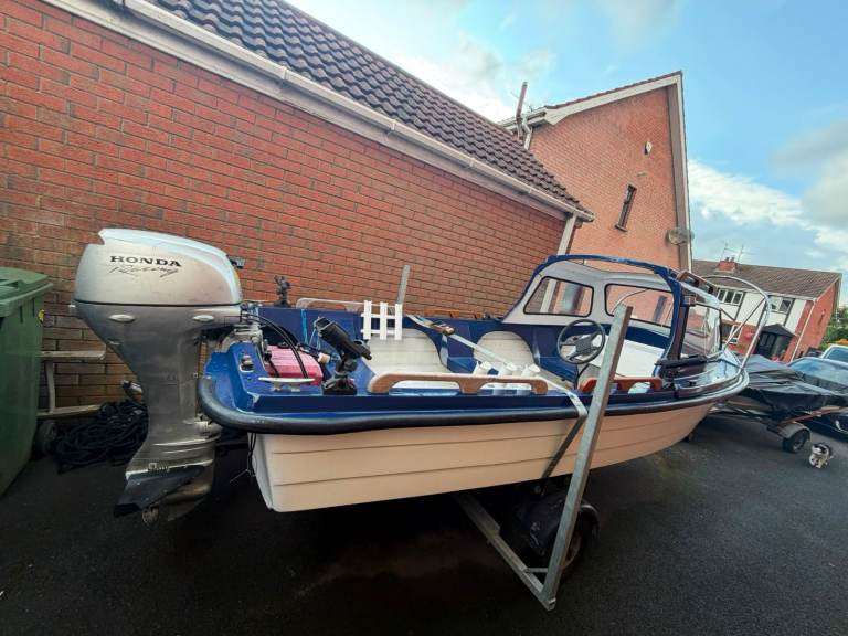 Honda Outboard Motor and Small Boat with Trailer – Good Condition