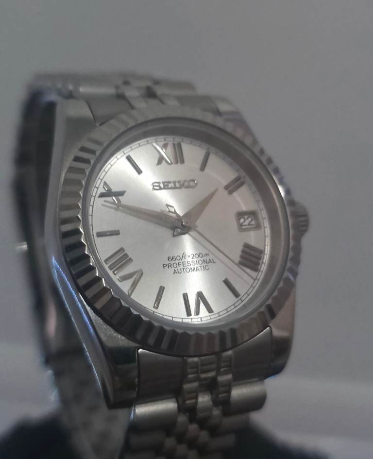 White automatic seiko roman numeral dial