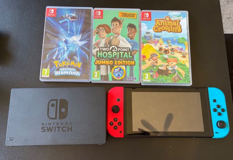 Nintendo Switch Console with Dock and 3 Games – Good Condition