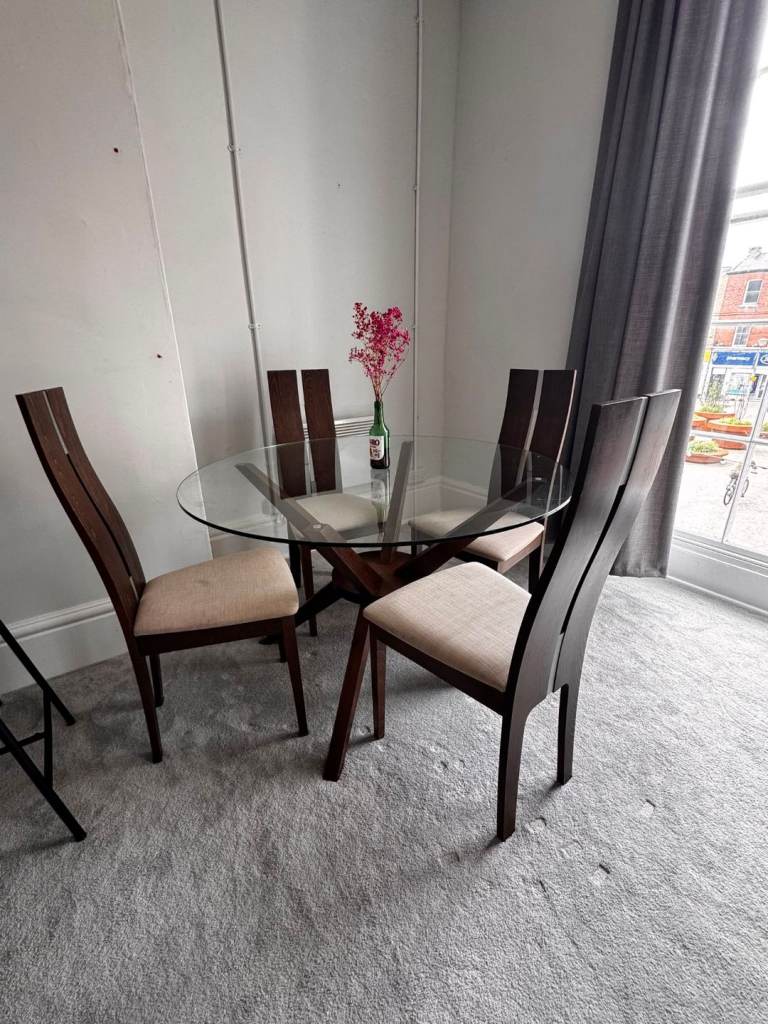 Glass Top Dining Table with 4 Wooden Chairs – Good Condition