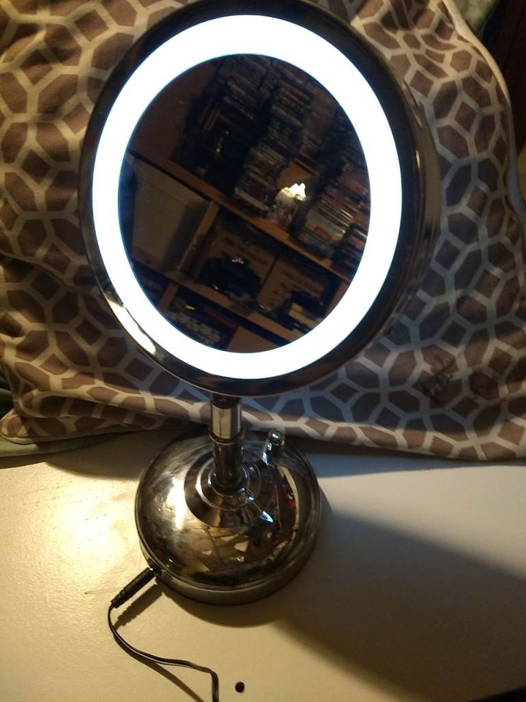 Tilting face mirror with magnifier and bright light rim. Stainless steel. Boots 