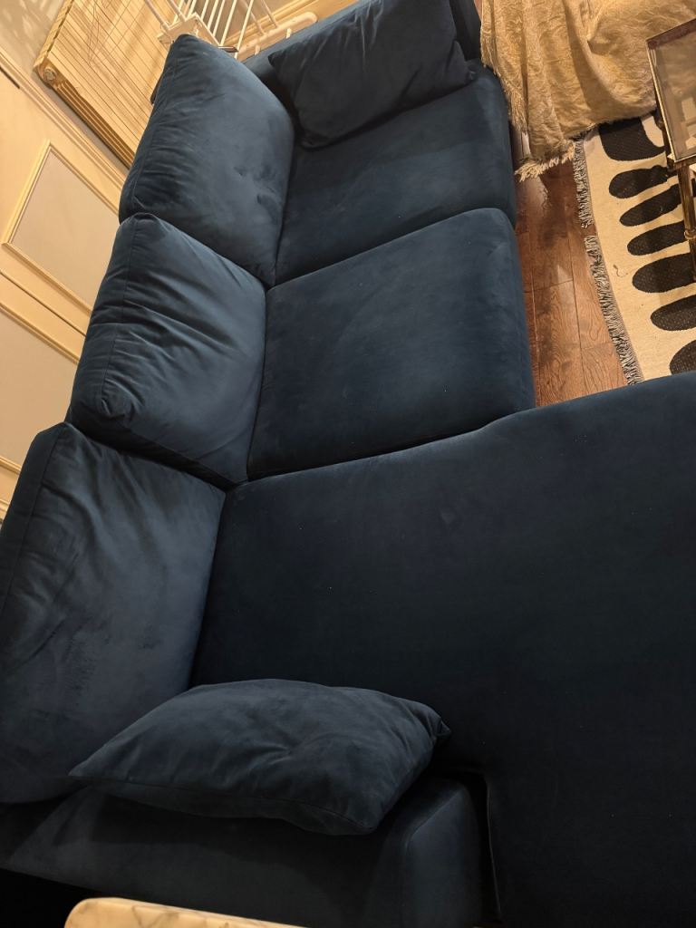Deep blue velvet  L shaped sectional sofa in excellent condition with throw and cushions