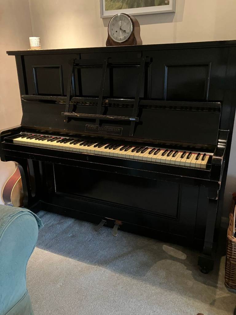 UPRIGHT ‘ZIMMERMAN’ PIANO ON WHEELS