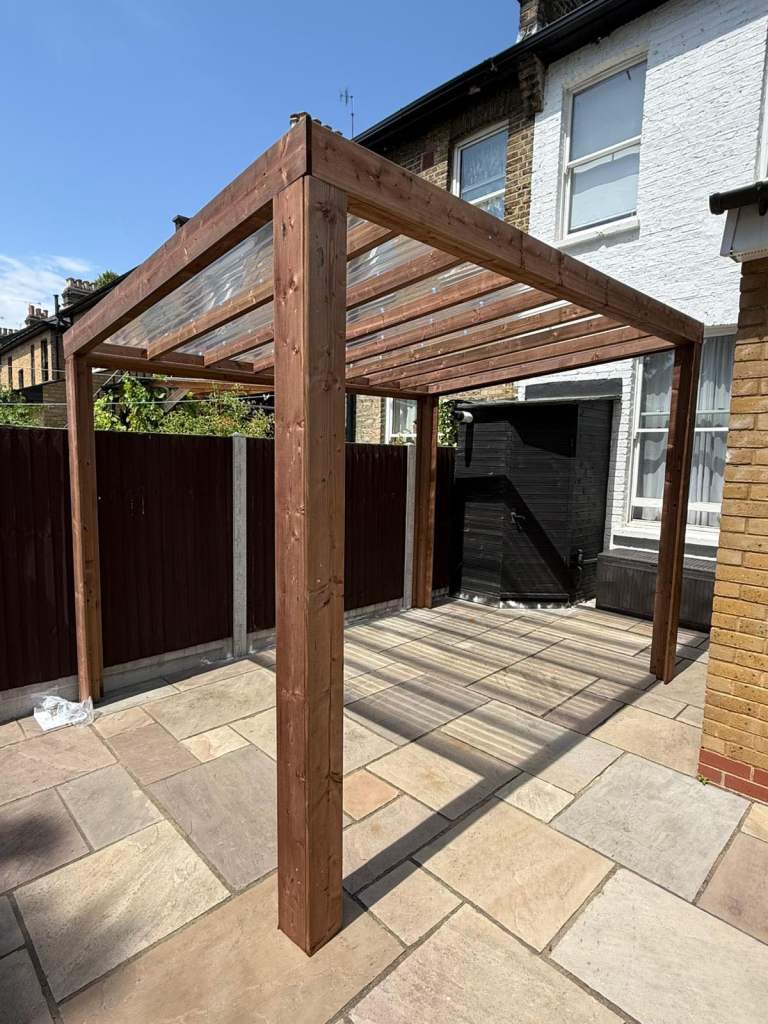 FREE DELIVERY Dunster House Wooden Pergola with Roof, in good condition.