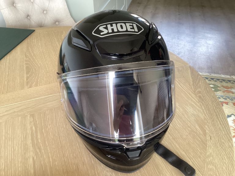 Shoei black motorcycle helmet.