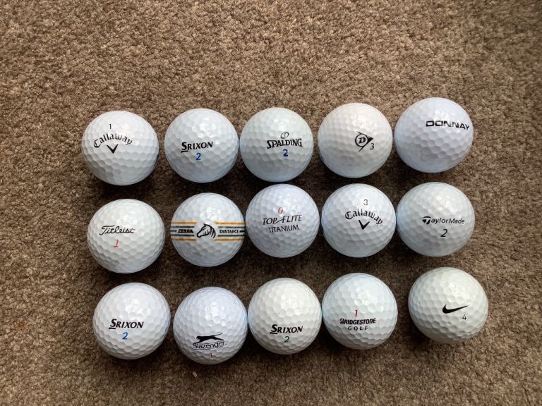 15 used golf balls