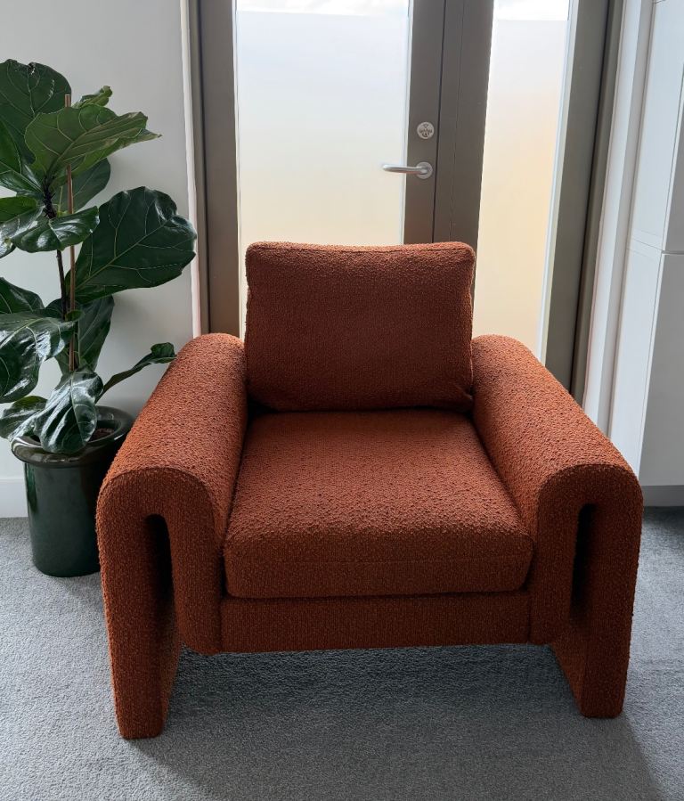 Lillian Daph Lita Rust Bouclé Armchair | Same chair for sale at Abigail Ahern 