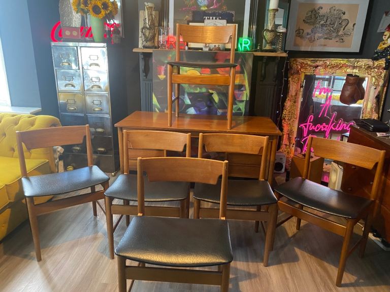 X 6 MIDCENTURY TEAK & VINYL DINING CHAIRS ,OVERALL CONDITION IS GOOD ,NO DAMAGE OR WOBBLES ,DELIVERY