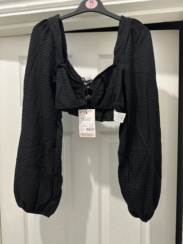 Black textured cropped top with statement balloon sleeves.. Brand new with tags & original bag