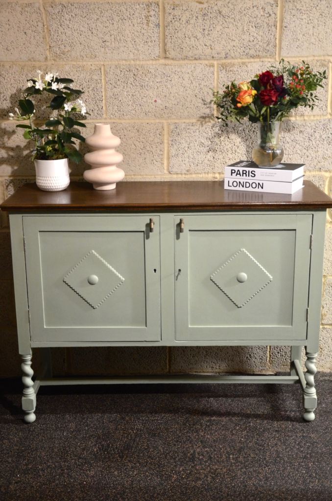 Freshly painted sage green side board