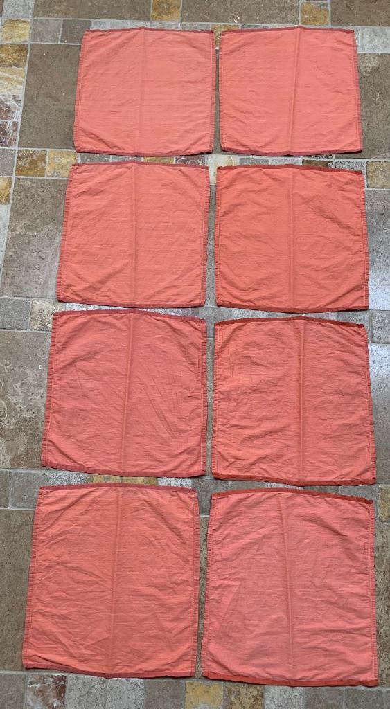 Eight cotton napkins