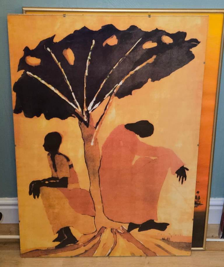 2 x glass framed African themed wall art.