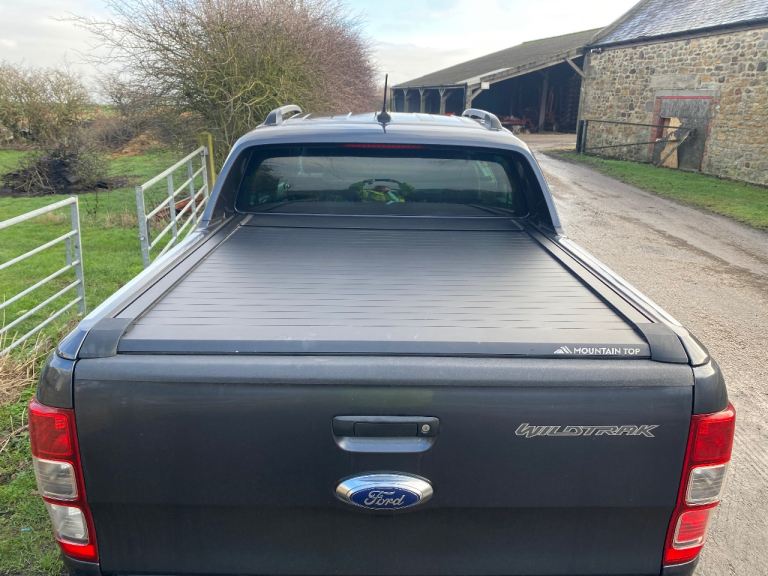 Mountain top roller shutter and spoiler 