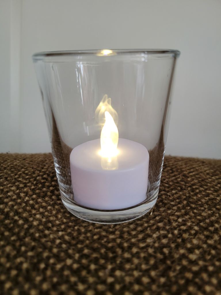 Flickering Tea Lights in Glass Beakers