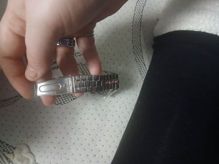 A pink sparkey gem stone silver watch