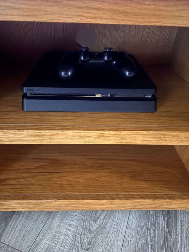 Sony PlayStation 4 Slim Console with Controller – Good Condition