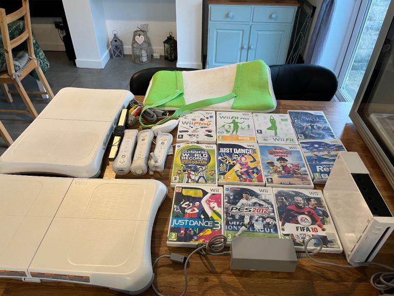 Wii console with games and 2 boards 