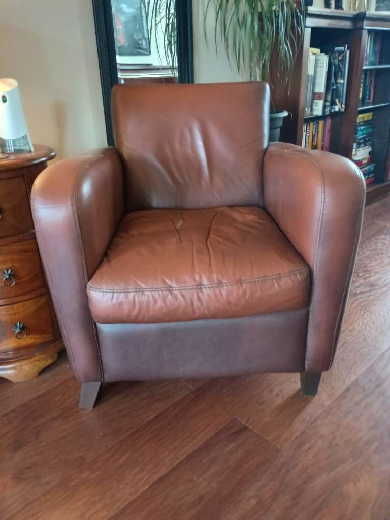 2 brown leather armchairs