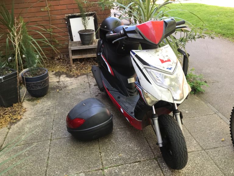 50 cc moped and two helmets 