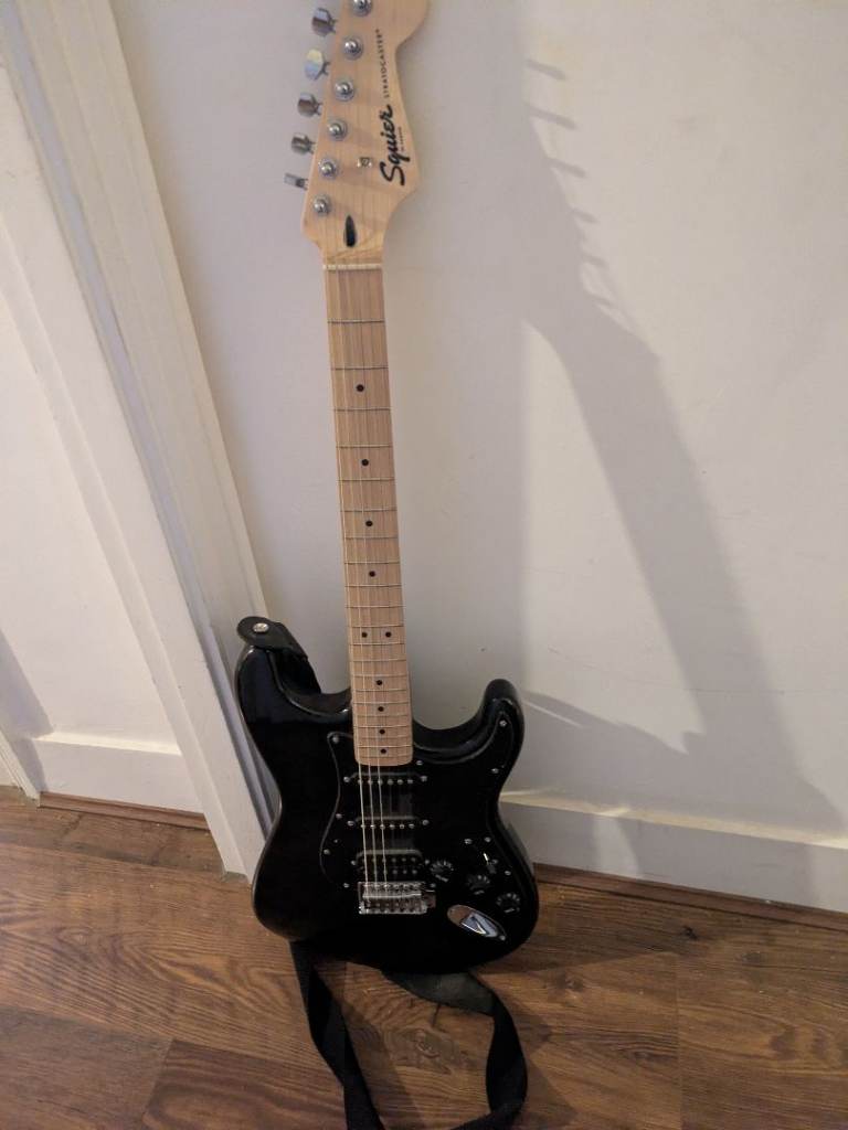 WANT TO SELL QUICKLY! Squier Sonic Strat HSS Black with a strap