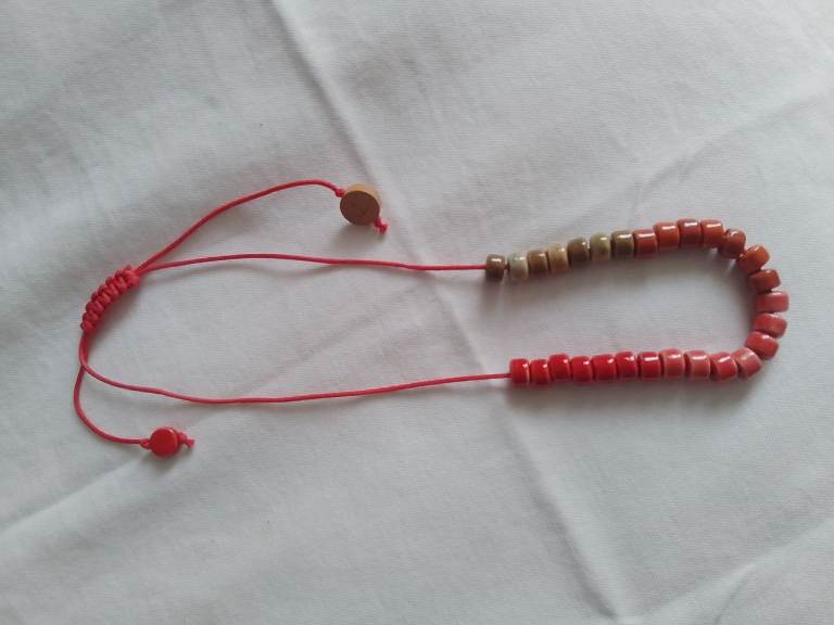 Adjustable Beaded Red and Earth Tone Bracelet
