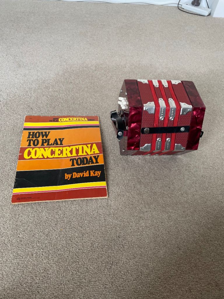 Red Concertina with 'How to Play' Book – Good Condition