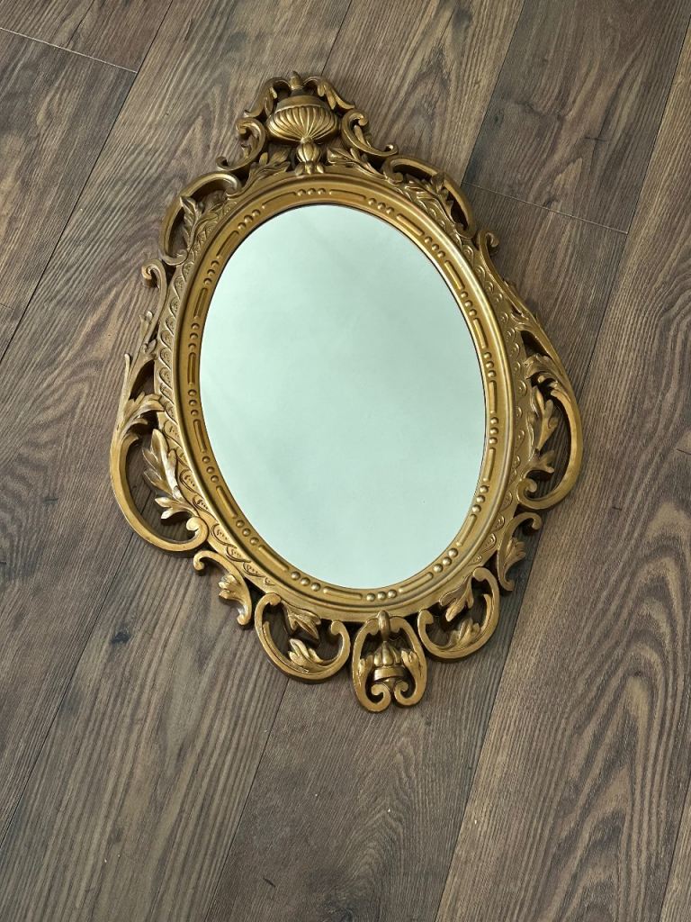 Ornate gold framed mirror 