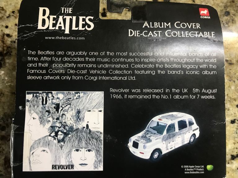 The Beatles ‘Revolver’ Album cover die cast collectable taxi with original packaging. Excellent con.