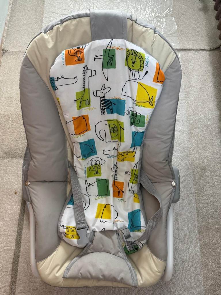 Colorful animal print baby bouncer seat.