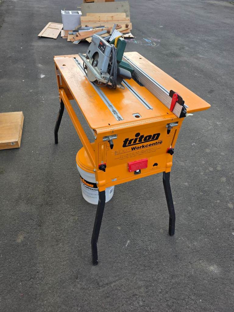 A triton 2000 Series work centre, a Bosch circular saw,Triton dust collection bucket and rip fence