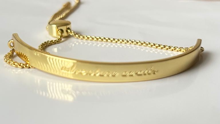 Gold adjustable bangle engraved adventure awaits