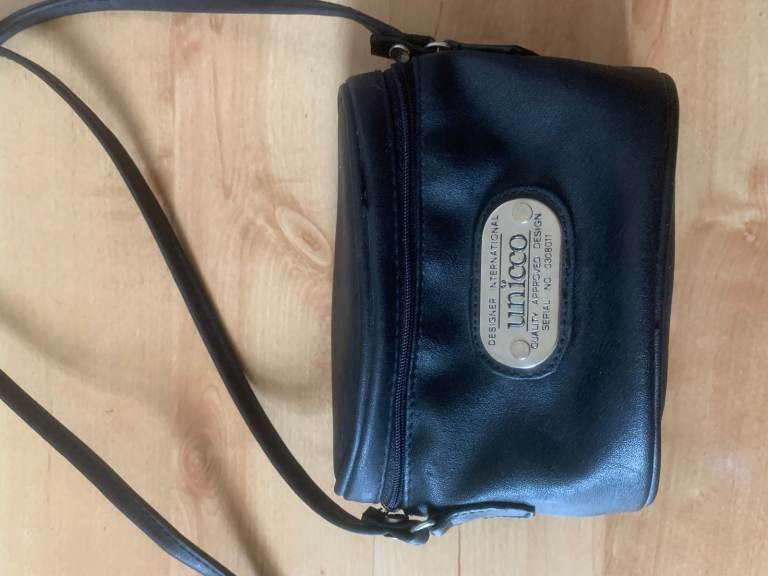 Attractive, well made, designer, leather, small shoulder bag , not used