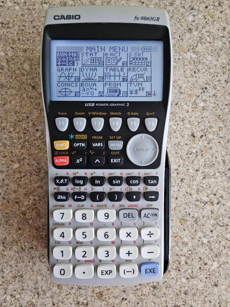Casio fx-9860GII graphing calculator with hard case