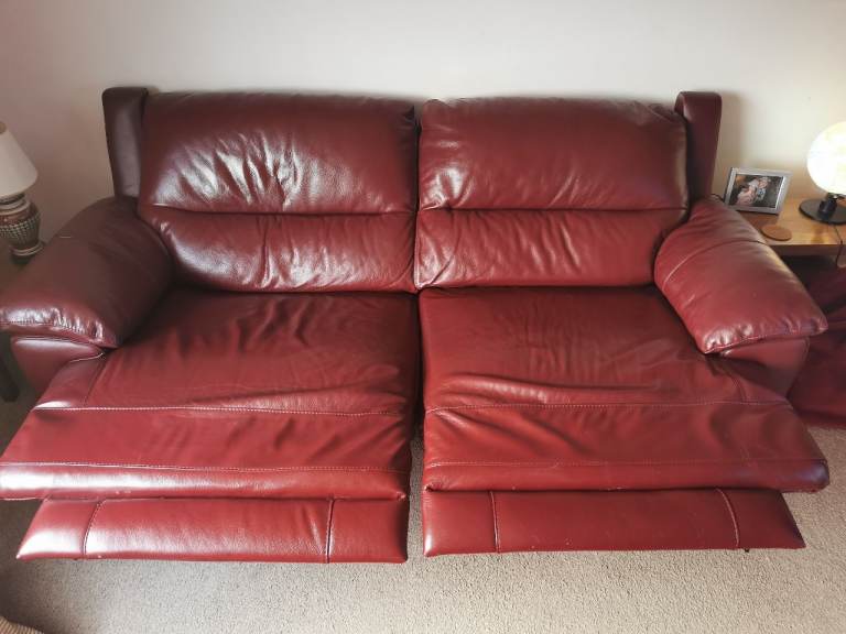Two Falcon 3 seater red leather reclining sofas