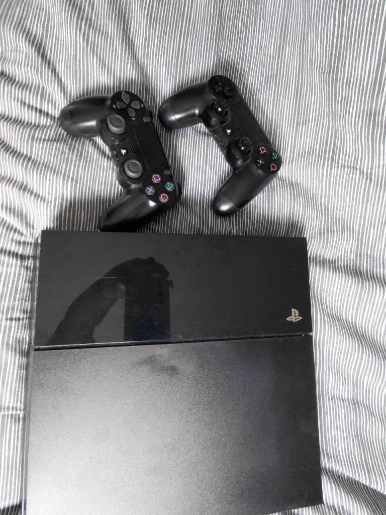 Sony PlayStation 4 with Two Controllers – Good Condition