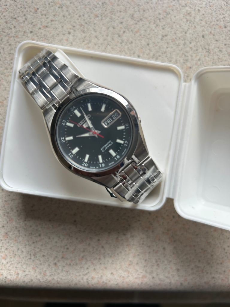 Seiko 5 SNKG23 stainless steel automatic watch.