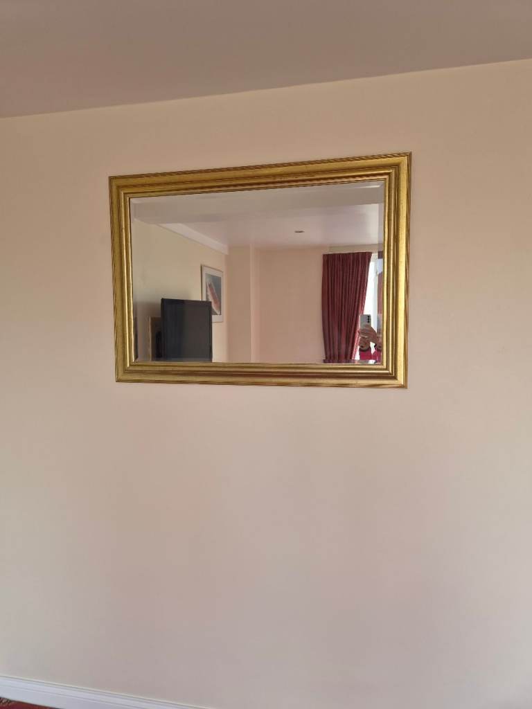Mirror with gold frame