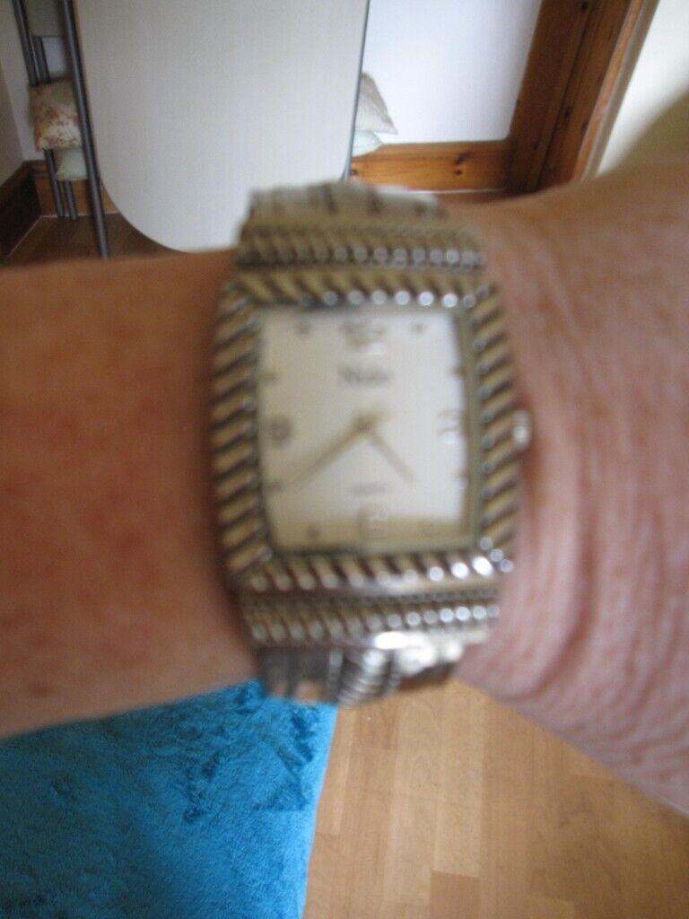 Ladies silver colour bangle watch new, Needs new battery