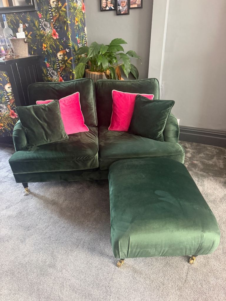 Green velvet sofa and pouffe