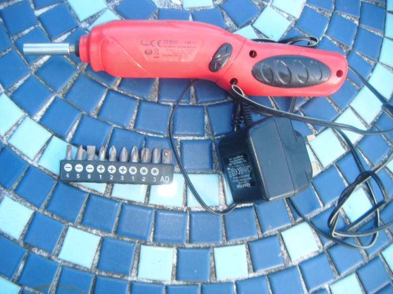 Red Cordless Electric Screwdriver with Bits and Charger
