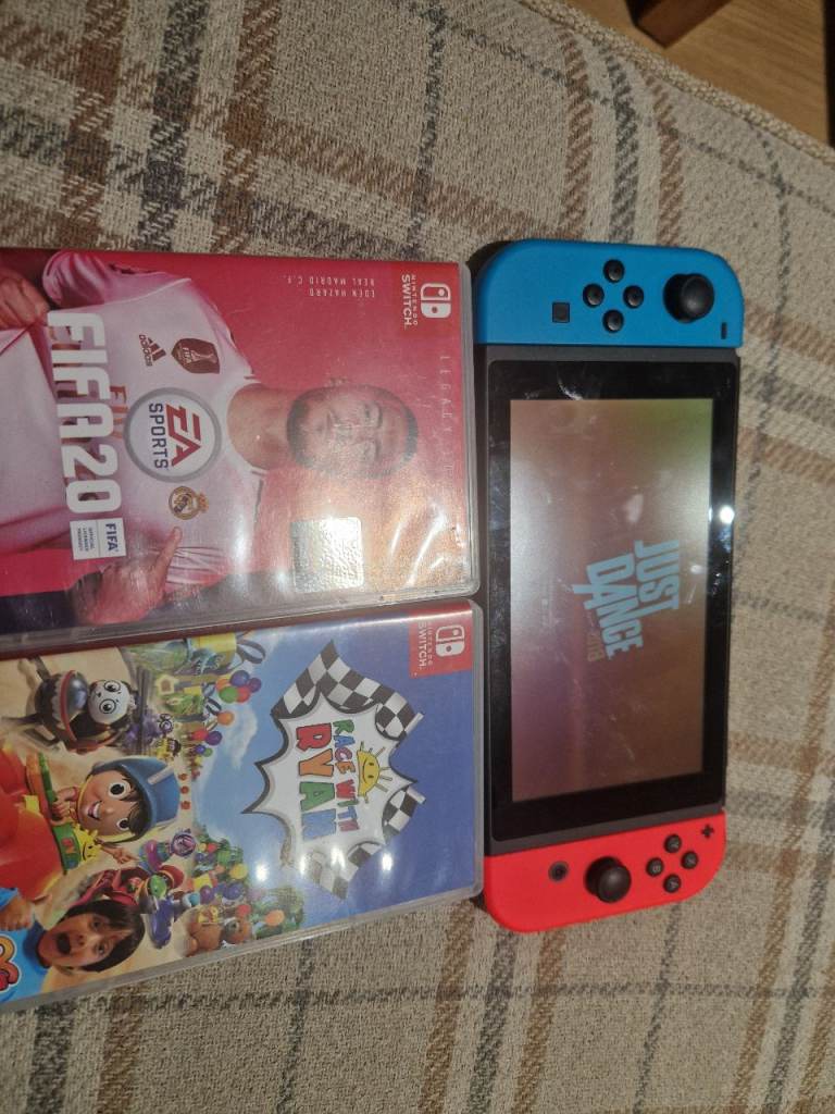 Nintendo switch console and 3 games race ryan just dance  fifa