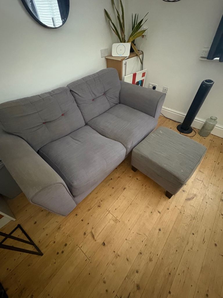 Grey Two-Seater Sofa with Matching Footstool – Good Condition
