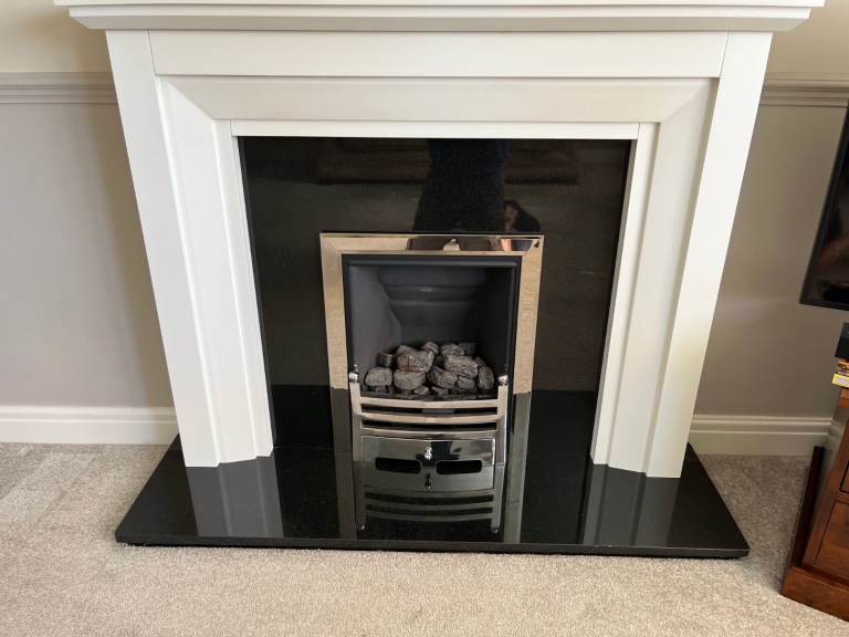 Fire surround with gas real flame fire.