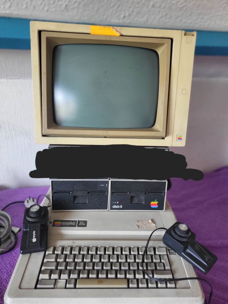 APPLE IIe COMPUTER WITH 2 DISK DRIVES, 2 PADDLES MONITOR STORED IN ATTIC