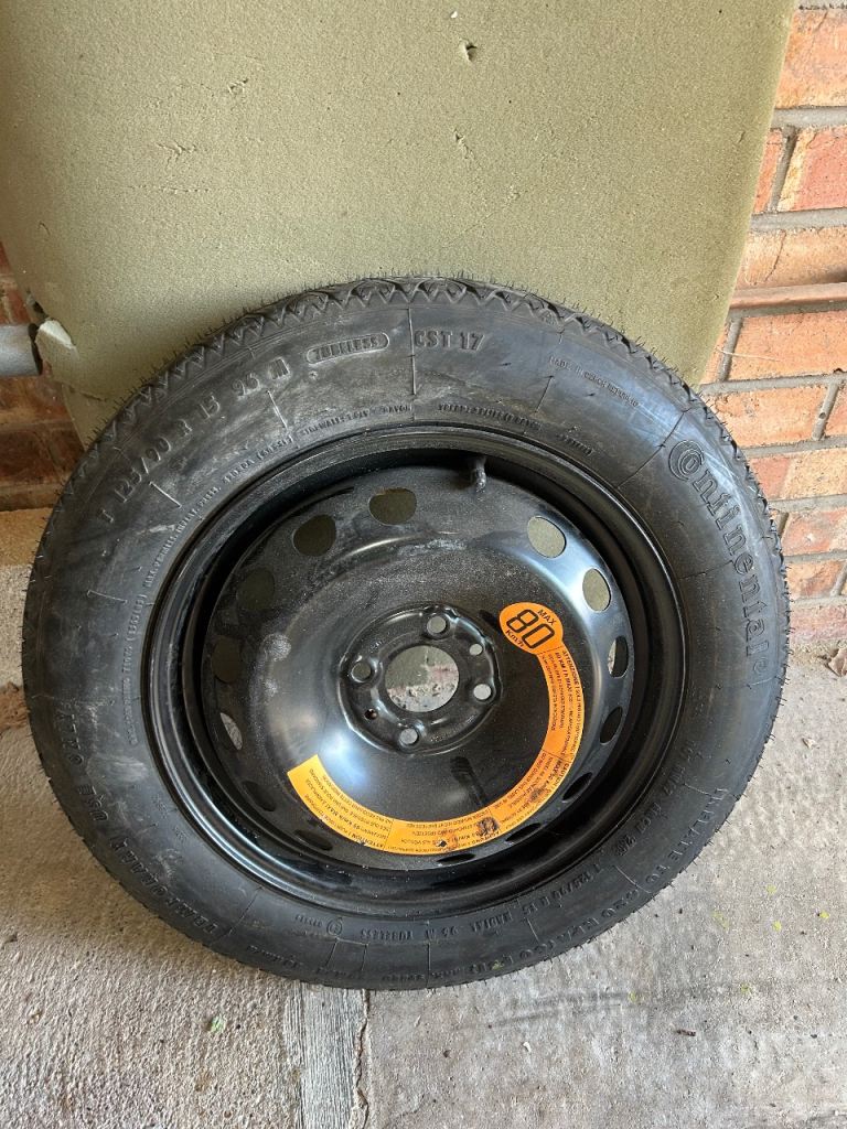 Unused space saver wheel and tyre 